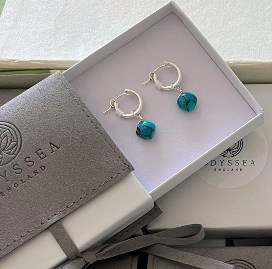 Turquoise Sterling Silver 925 Drop Hoop Earrings presented in Odyssea England gift box and soft eco friendly recycled jewellery pouch. Turquoise for protection.