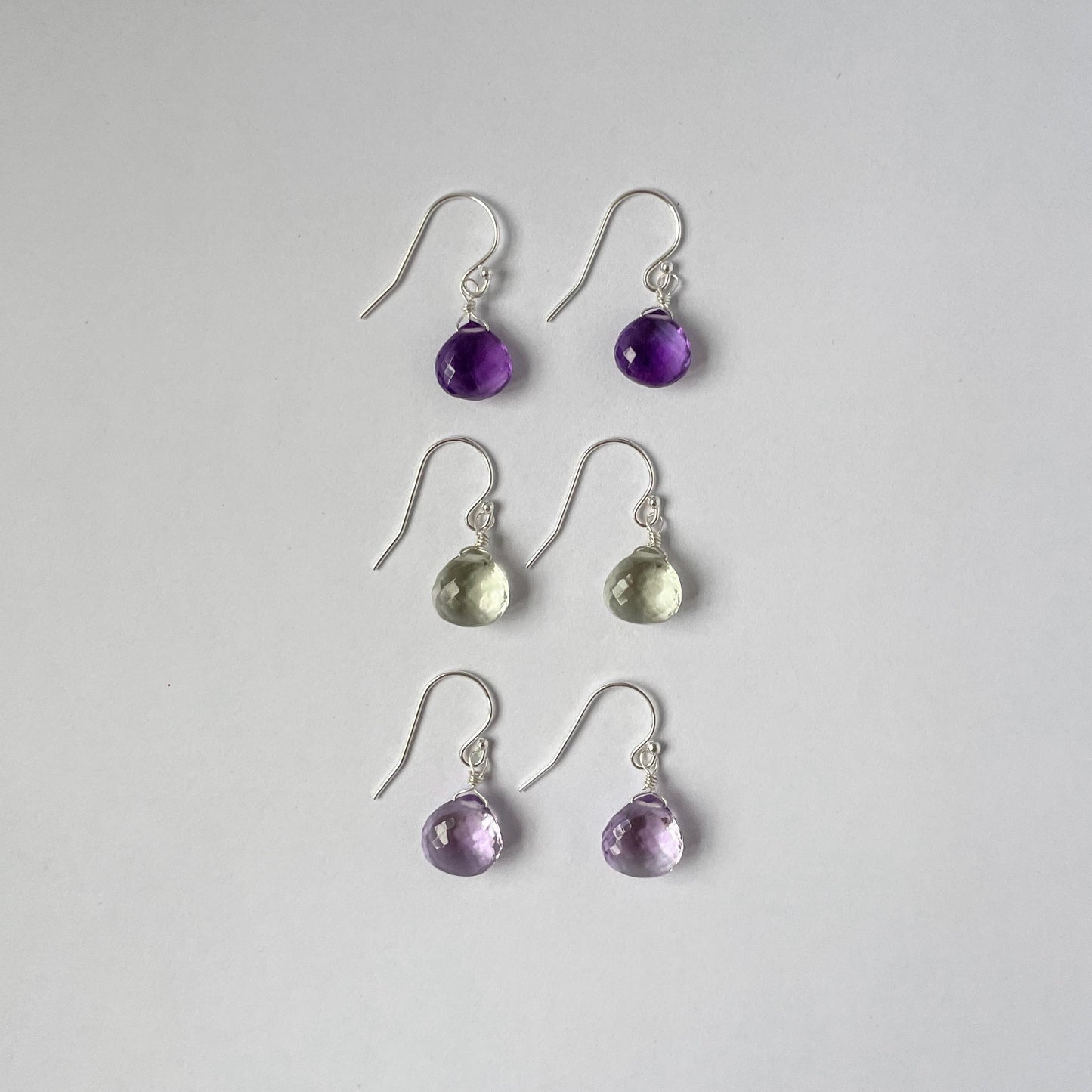 Three varieties of gemstone drop earrings offered by ODYSSEA ENGLAND